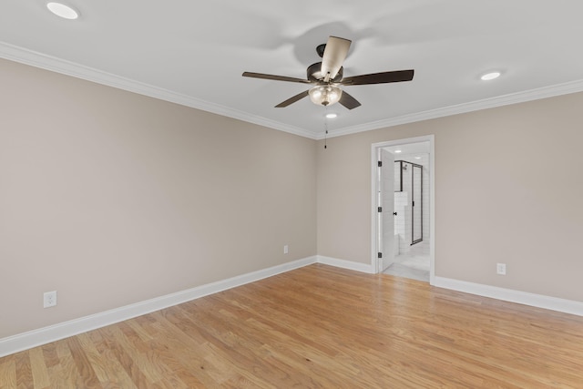 spare room featuring light hardwood / wood-style floors, ceiling fan, and crown molding