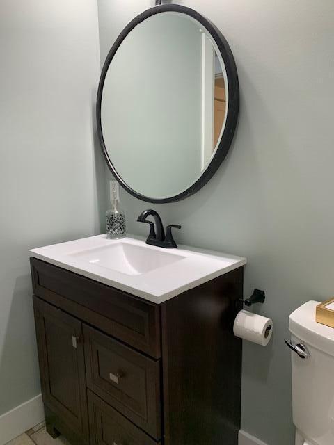 bathroom with vanity and toilet