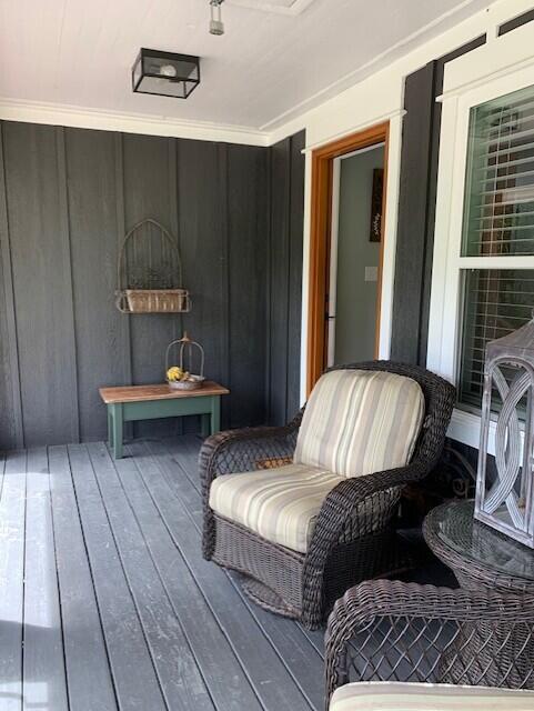 wooden terrace with a porch