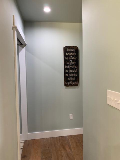 interior details featuring hardwood / wood-style flooring