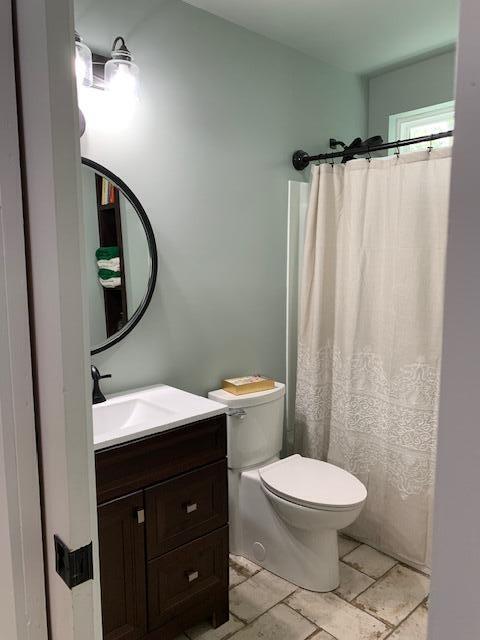 bathroom with vanity and toilet