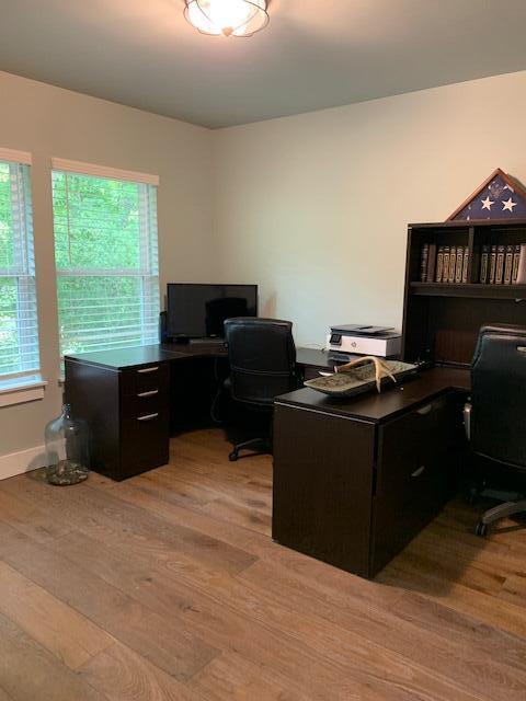 office with light wood-type flooring