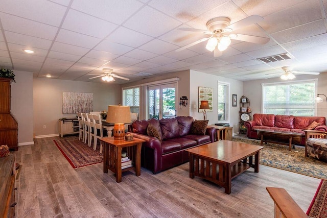 436 Oak Hills Drive Lots 4.5 & 6, Spring City, TN 37381 - living area with a ceiling fan, wood finished floors, a drop ceiling, and healthy amount of natural light