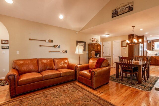 436 Oak Hills Drive Lots 4.5 & 6, Spring City, TN 37381 - living area featuring light wood finished floors, arched walkways, lofted ceiling, a chandelier, and recessed lighting