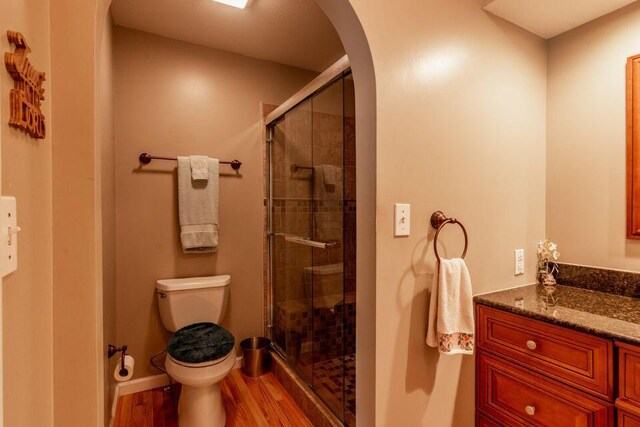 436 Oak Hills Drive Lots 4.5 & 6, Spring City, TN 37381 - bathroom featuring toilet, a stall shower, wood finished floors, and vanity