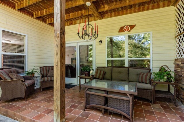 436 Oak Hills Drive Lots 4.5 & 6, Spring City, TN 37381 - sunroom featuring an outdoor living space, beamed ceiling, and a chandelier