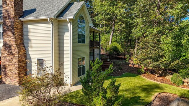 436 Oak Hills Drive Lots 4.5 & 6, Spring City, TN 37381 - view of side of property with a shingled roof, a yard, a chimney, and stairs