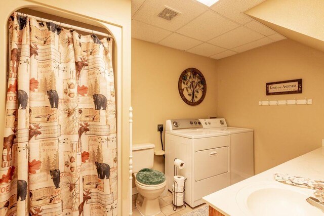 436 Oak Hills Drive Lots 4.5 & 6, Spring City, TN 37381 - bathroom featuring a drop ceiling, washing machine and clothes dryer, tile patterned flooring, toilet, and vanity