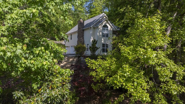 436 Oak Hills Drive Lots 4.5 & 6, Spring City, TN 37381 - view of side of home with a chimney and a garage