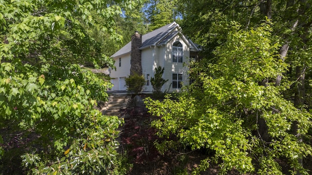 436 Oak Hills Drive Lots 4.5 & 6, Spring City, TN 37381 - view of side of home with a chimney and a garage