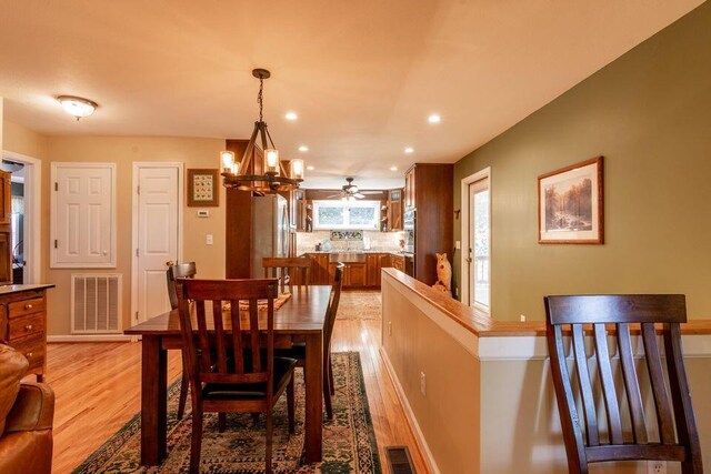436 Oak Hills Drive Lots 4.5 & 6, Spring City, TN 37381 - dining space with light wood finished floors, a chandelier, recessed lighting, a ceiling fan, and baseboards