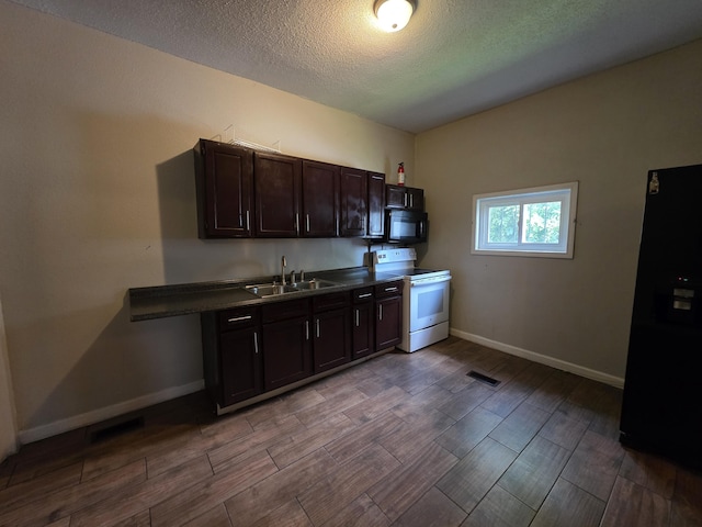 3817 Kirkland Ave, Chattanooga, TN 37410 - kitchen featuring black appliances, wood finished floors, dark countertops, dark brown cabinetry, and a textured ceiling