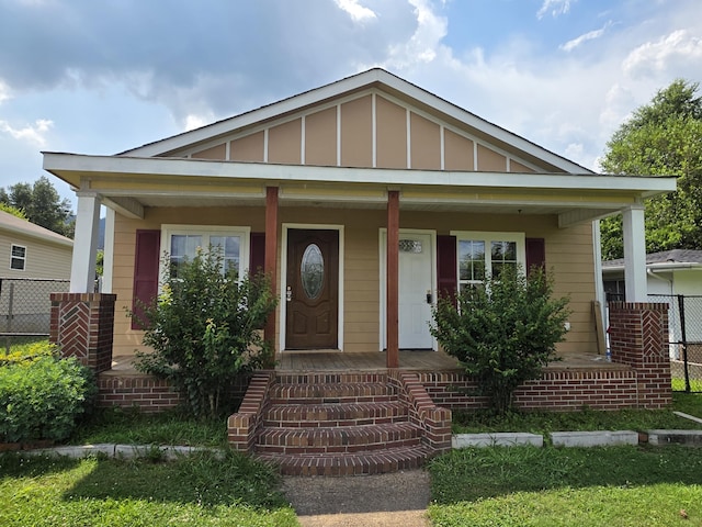3817 Kirkland Ave, Chattanooga, TN 37410 - view of front of property featuring covered porch and board and batten siding