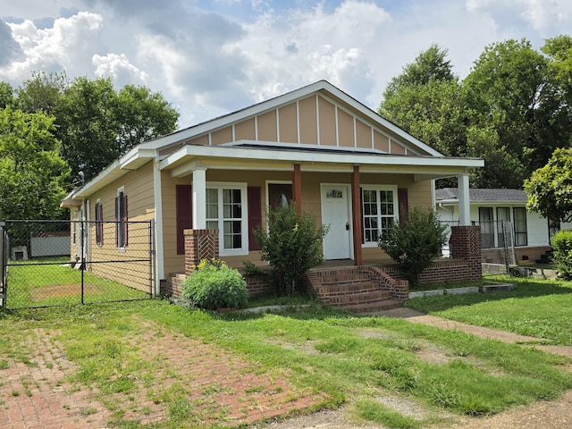 3817 Kirkland Ave, Chattanooga, TN 37410 - view of front of house with a porch, board and batten siding, and a gate