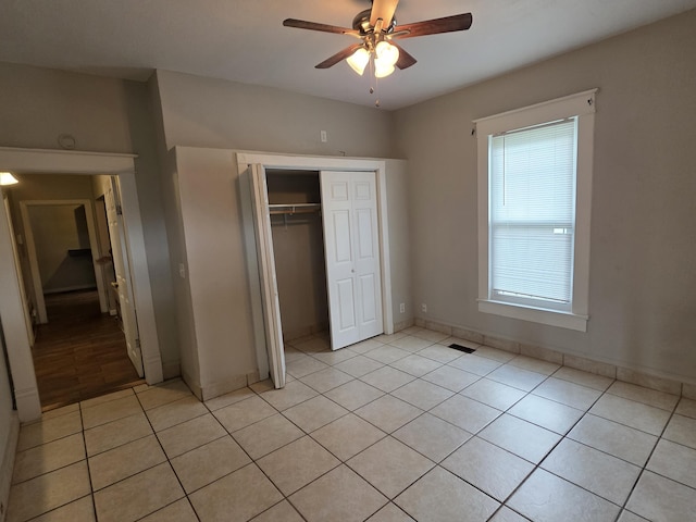 3817 Kirkland Ave, Chattanooga, TN 37410 - unfurnished bedroom featuring light tile patterned floors, a closet, and a ceiling fan