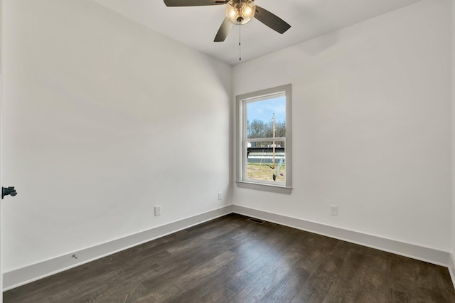 164 Mcnabb Dr, Cleveland, TN 37312 - spare room featuring visible vents, baseboards, ceiling fan, and dark wood-style flooring