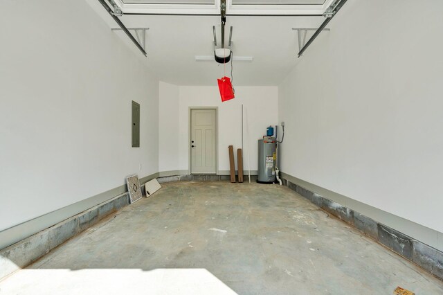 164 Mcnabb Dr, Cleveland, TN 37312 - garage with electric panel, electric water heater, and a garage door opener