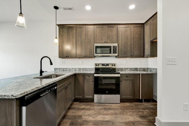 164 Mcnabb Dr, Cleveland, TN 37312 - kitchen featuring a sink, visible vents, backsplash, and appliances with stainless steel finishes