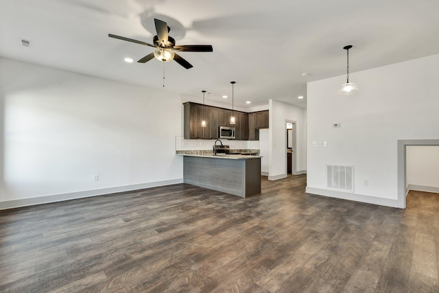 164 Mcnabb Dr, Cleveland, TN 37312 - kitchen featuring open floor plan, stainless steel microwave, visible vents, and dark brown cabinetry