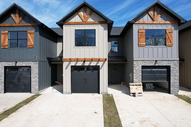164 Mcnabb Dr, Cleveland, TN 37312 - view of front of property featuring stone siding, an attached garage, concrete driveway, and board and batten siding