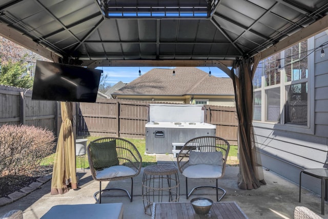 view of patio / terrace with a gazebo and fence