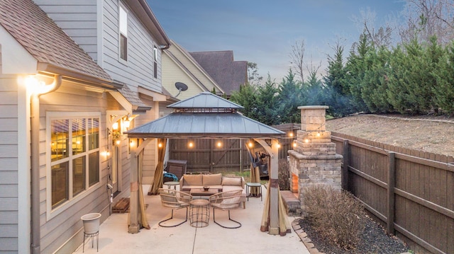 view of patio with a gazebo, fence, and an outdoor living space