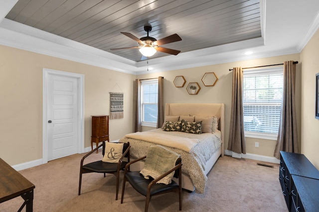 bedroom with visible vents, a raised ceiling, light colored carpet, and baseboards