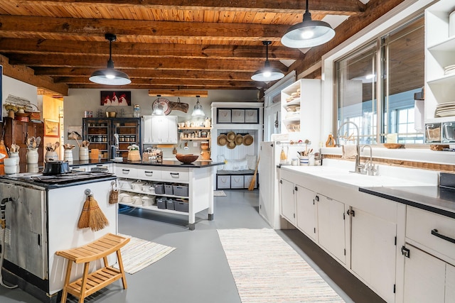 kitchen with wood ceiling, beam ceiling, hanging light fixtures, and white cabinets