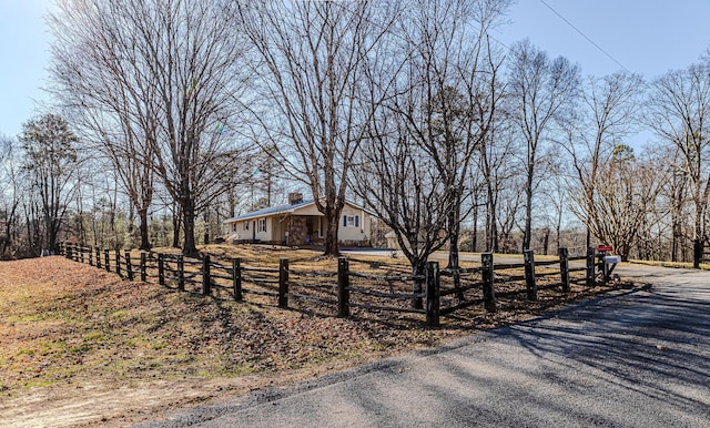 view of front facade with a rural view