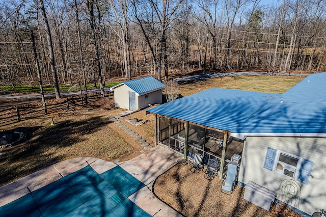 exterior space with a shed