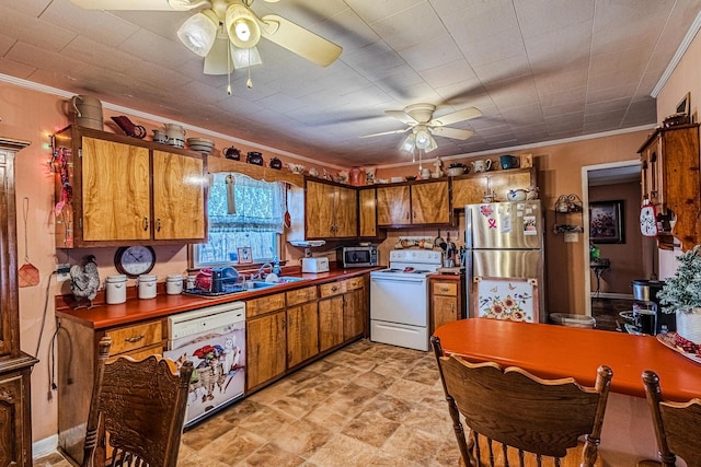 kitchen featuring crown molding, sink, ceiling fan, and appliances with stainless steel finishes