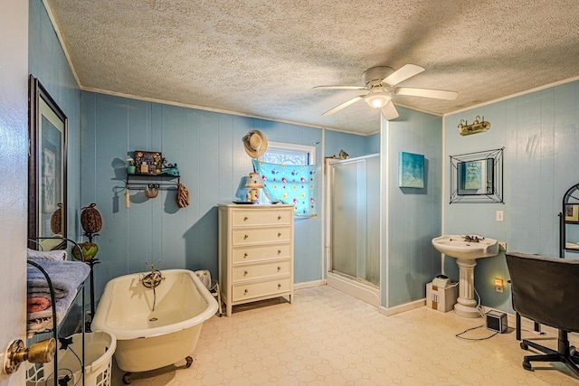 interior space featuring ceiling fan, wood walls, and ornamental molding