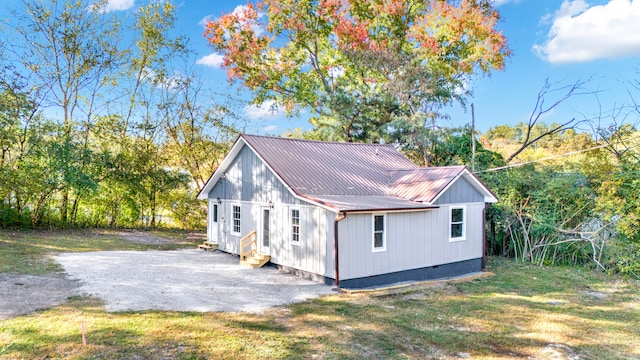 view of side of property with a yard