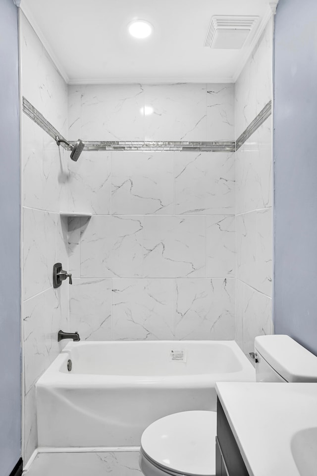 full bathroom featuring vanity, toilet, and tiled shower / bath combo