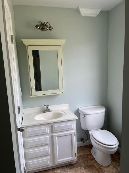 bathroom with vanity and toilet