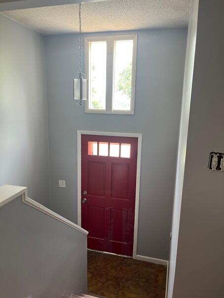 entrance foyer with a textured ceiling