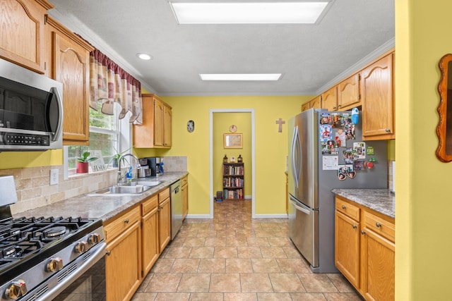 393 Friendship Ln, Delano, TN 37325 - kitchen with appliances with stainless steel finishes, a sink, backsplash, crown molding, and baseboards