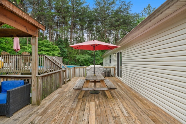 393 Friendship Ln, Delano, TN 37325 - wooden terrace featuring outdoor dining space and an outdoor pool
