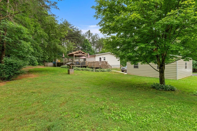 393 Friendship Ln, Delano, TN 37325 - view of green lawn featuring a wooden deck