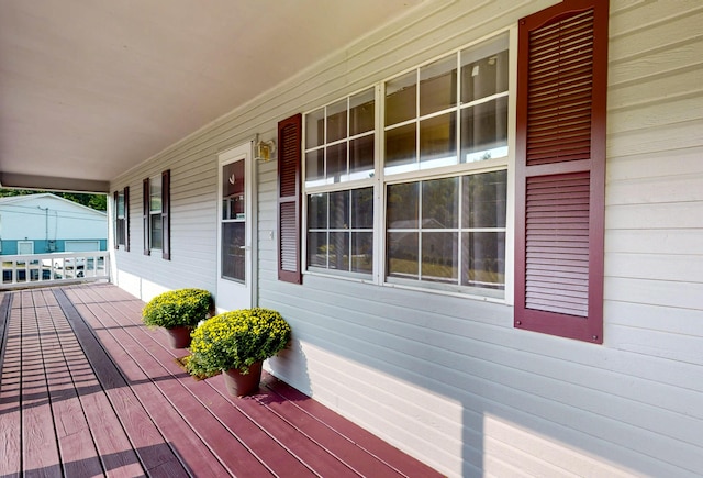 wooden deck featuring covered porch