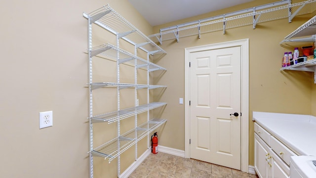 laundry room with cabinets