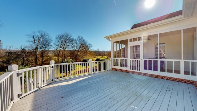 wooden terrace featuring a sunroom