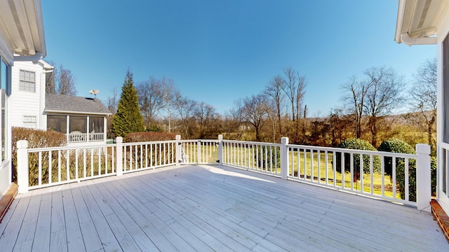 wooden terrace featuring a sunroom