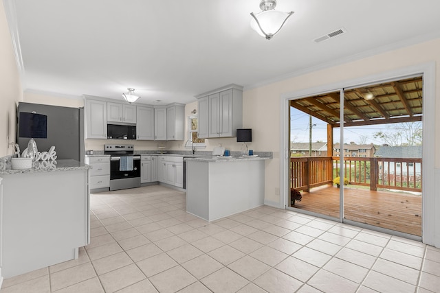 kitchen featuring gray cabinets, light tile patterned flooring, ornamental molding, and appliances with stainless steel finishes