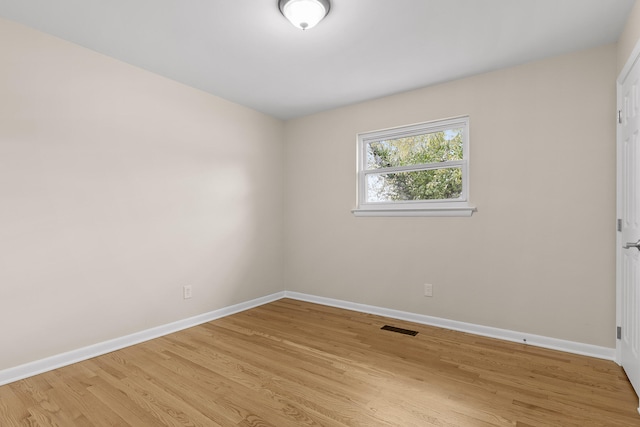 unfurnished room with light hardwood / wood-style flooring