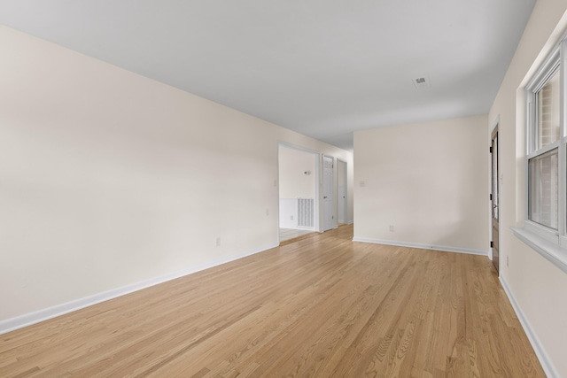 spare room with light hardwood / wood-style floors