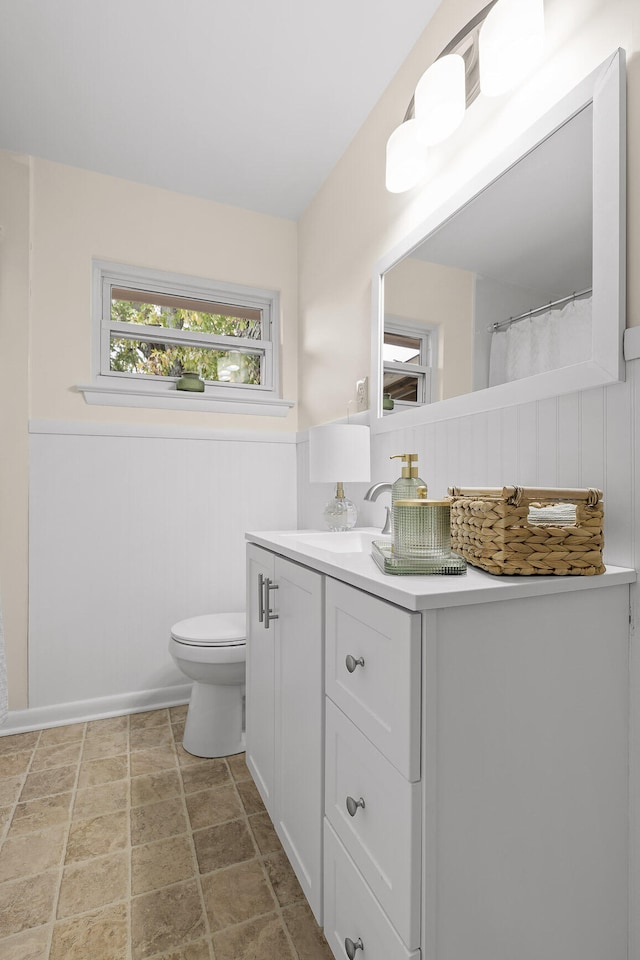 bathroom with vanity and toilet