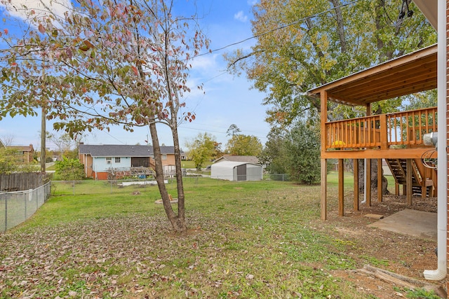 view of yard featuring a wooden deck