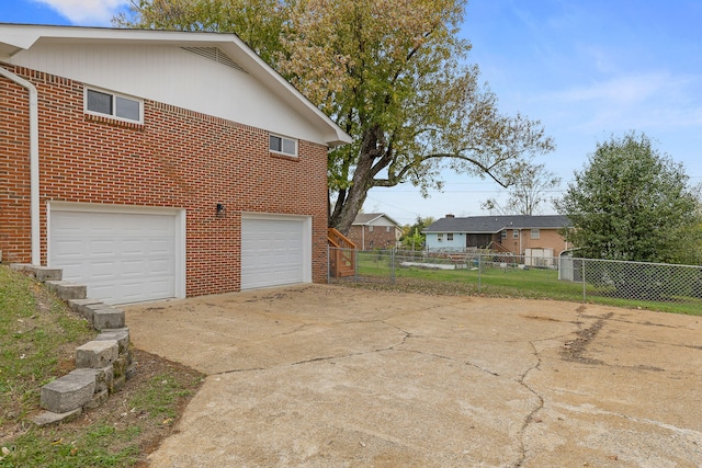 view of side of home with a garage