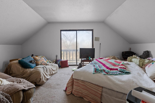 bedroom with access to exterior, vaulted ceiling, a textured ceiling, and carpet